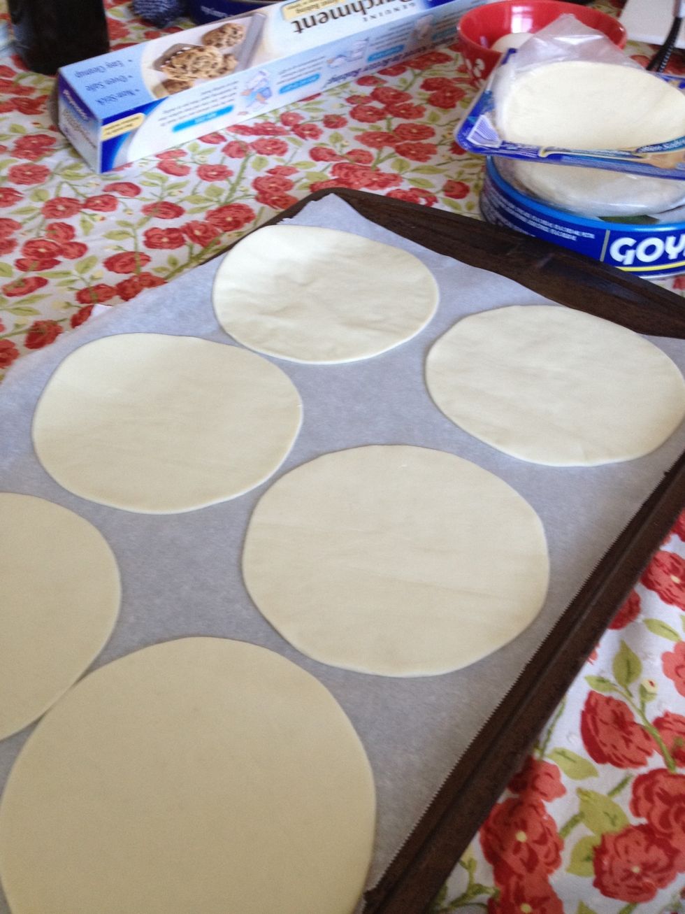 Lay 6 puff pastry circles (or squares) on each cookie sheet. (By the way, you can also make a pastry dough from scratch but then this recipe would not busy as fast and easy).