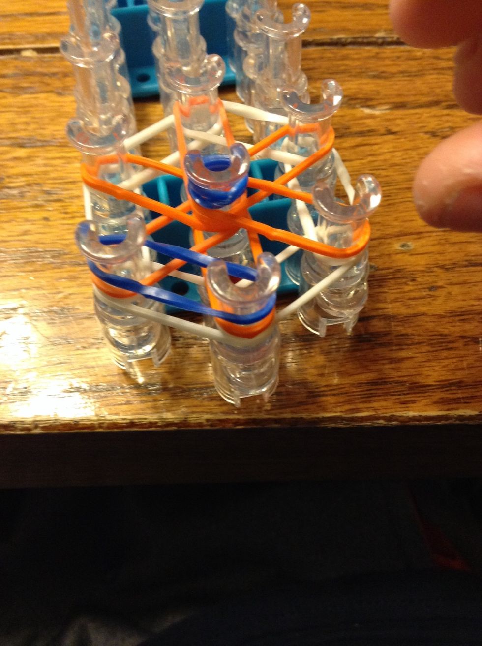 Lay a third color band as shown.