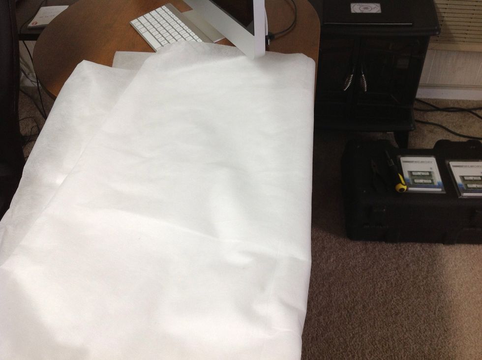 Lay a towel or soft cloth on flat desktop area as you will need to lay iMac face down.