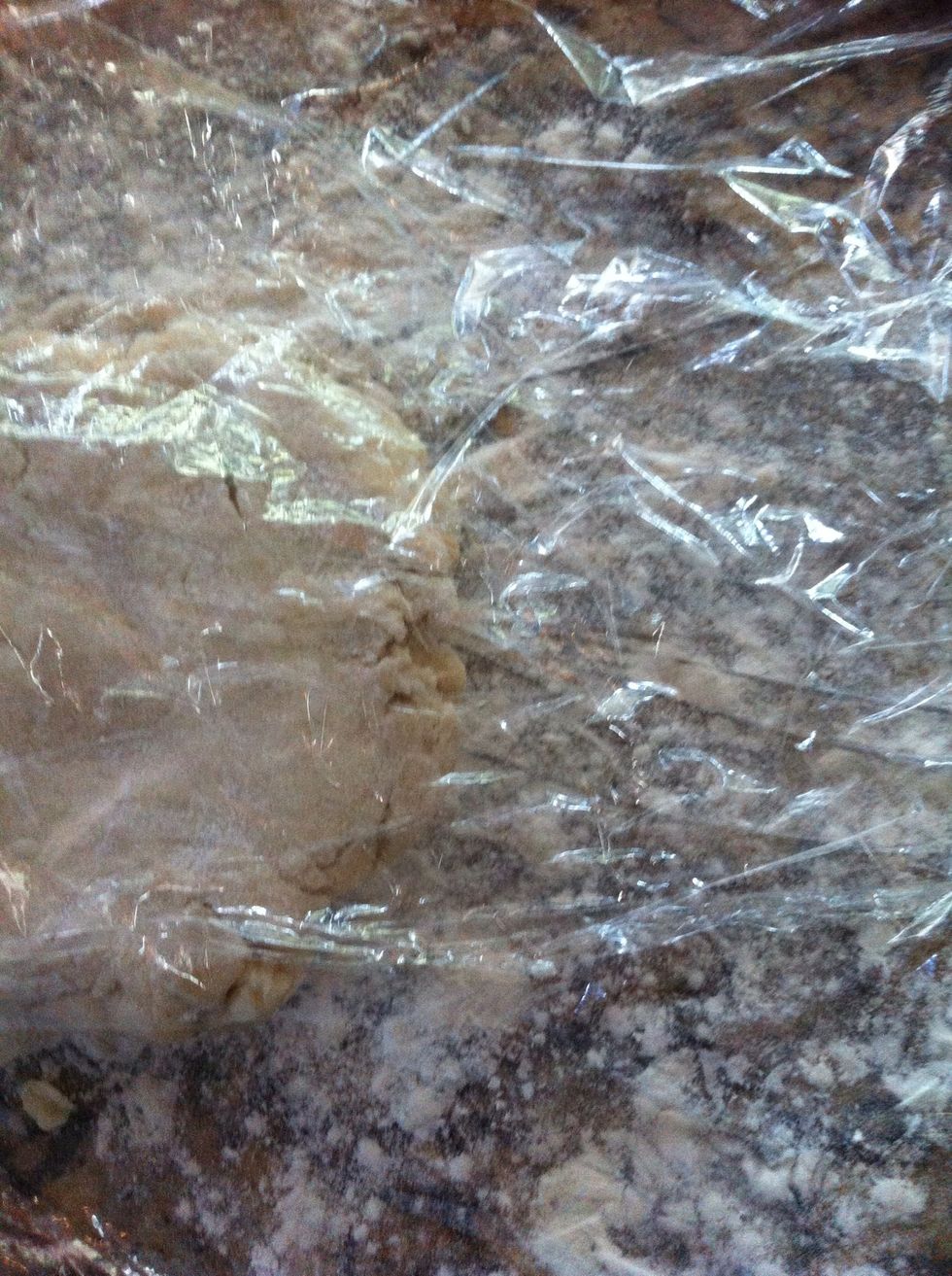 Lay another layer of plastic wrap over the dough and roll out to about 1/2 inch thickness