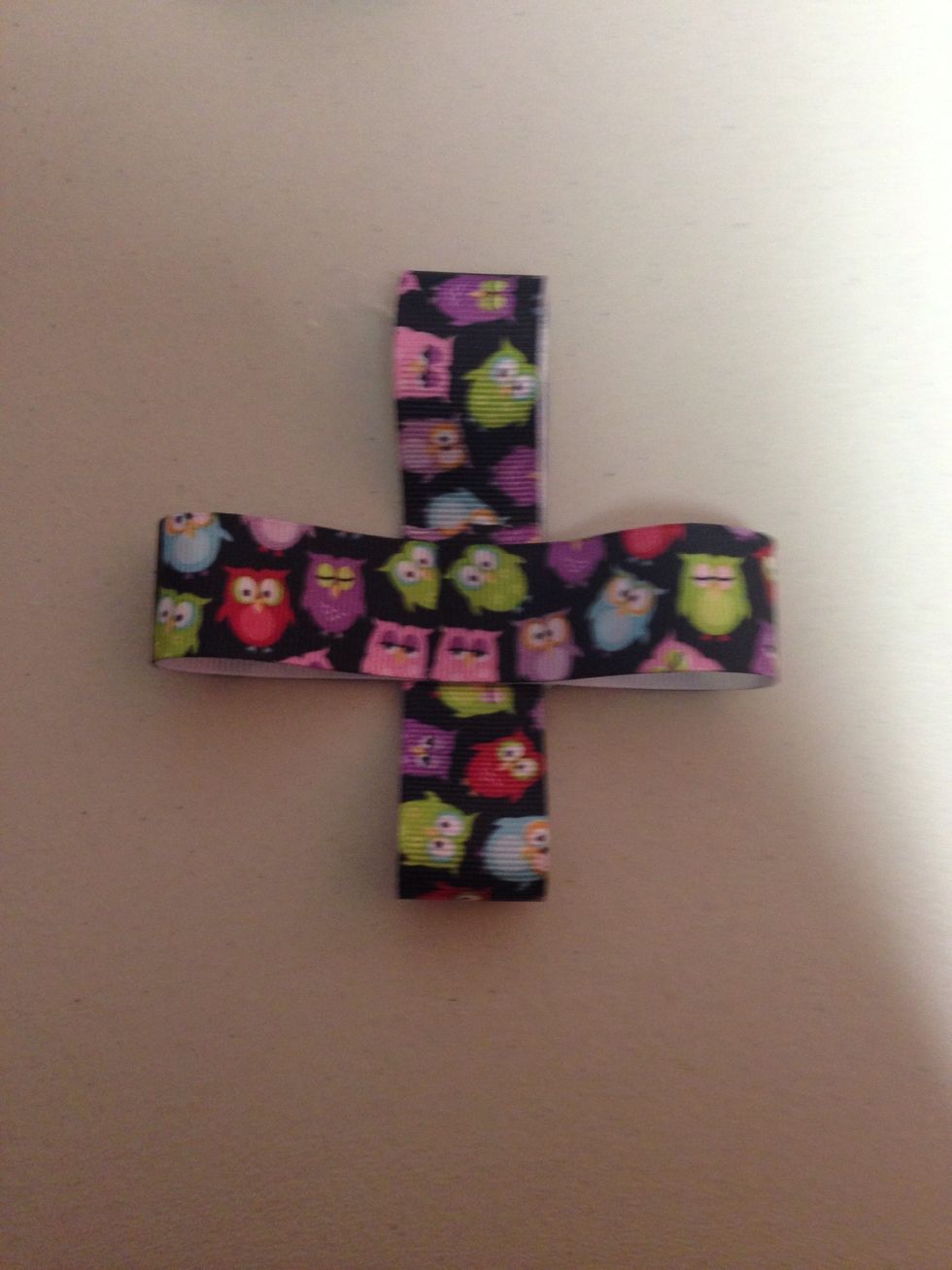 Lay another piece if ribbon on top