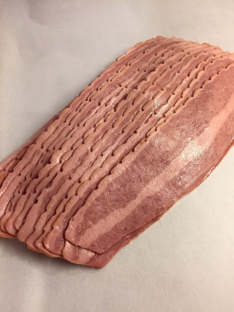 Lay bacon out in jelly roll pan, lined with parchment.