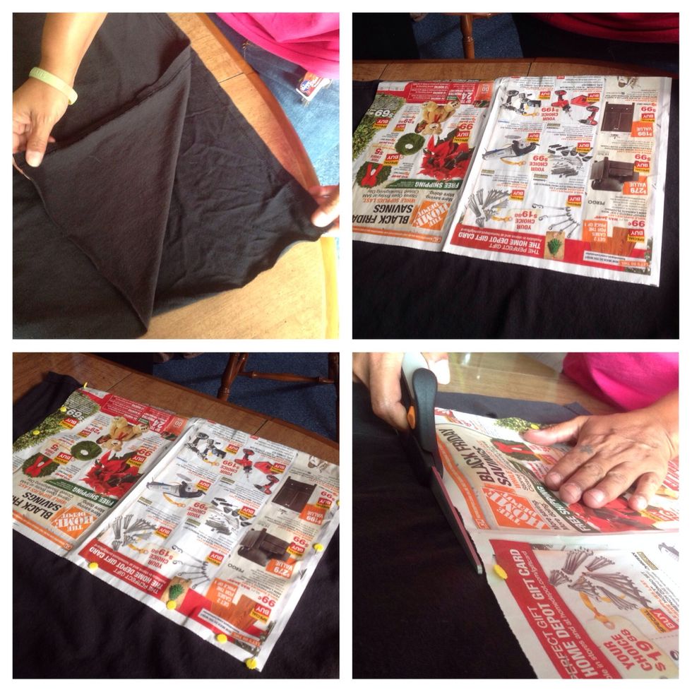 Lay both the back and the remainder of the front panels of tee together, lining up the bottom hems. Pin the 2nd piece of paper to both layers, leaving the hem side unpinned, & cut around the pattern.