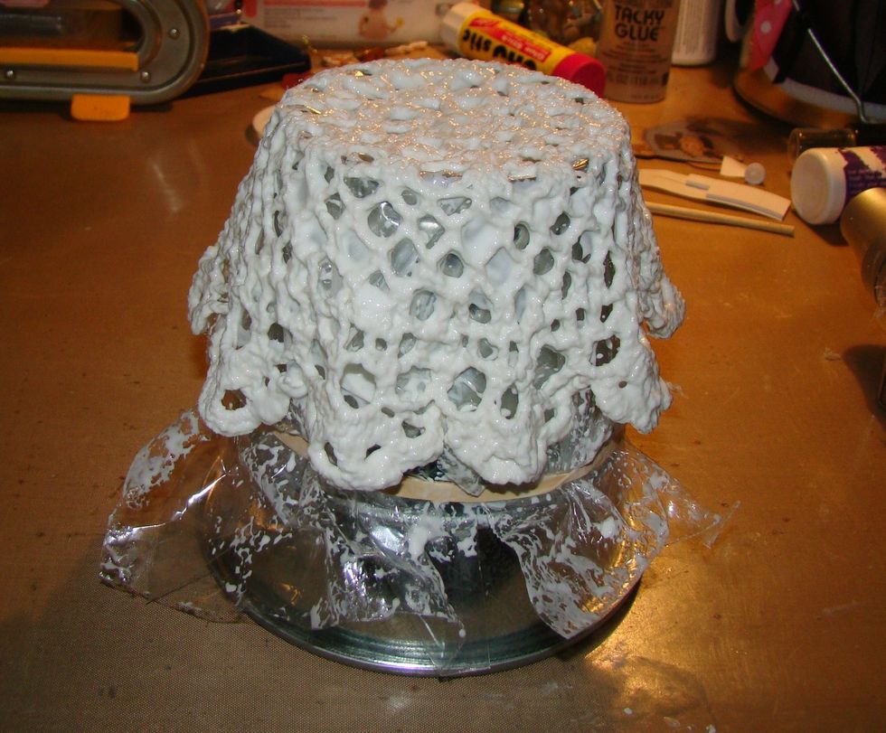 Lay doily over the can or bowl to form your basket. You can create folds in the doily by pinching the sides which will give a ruffle effect to your basket. Allow to dry over night .