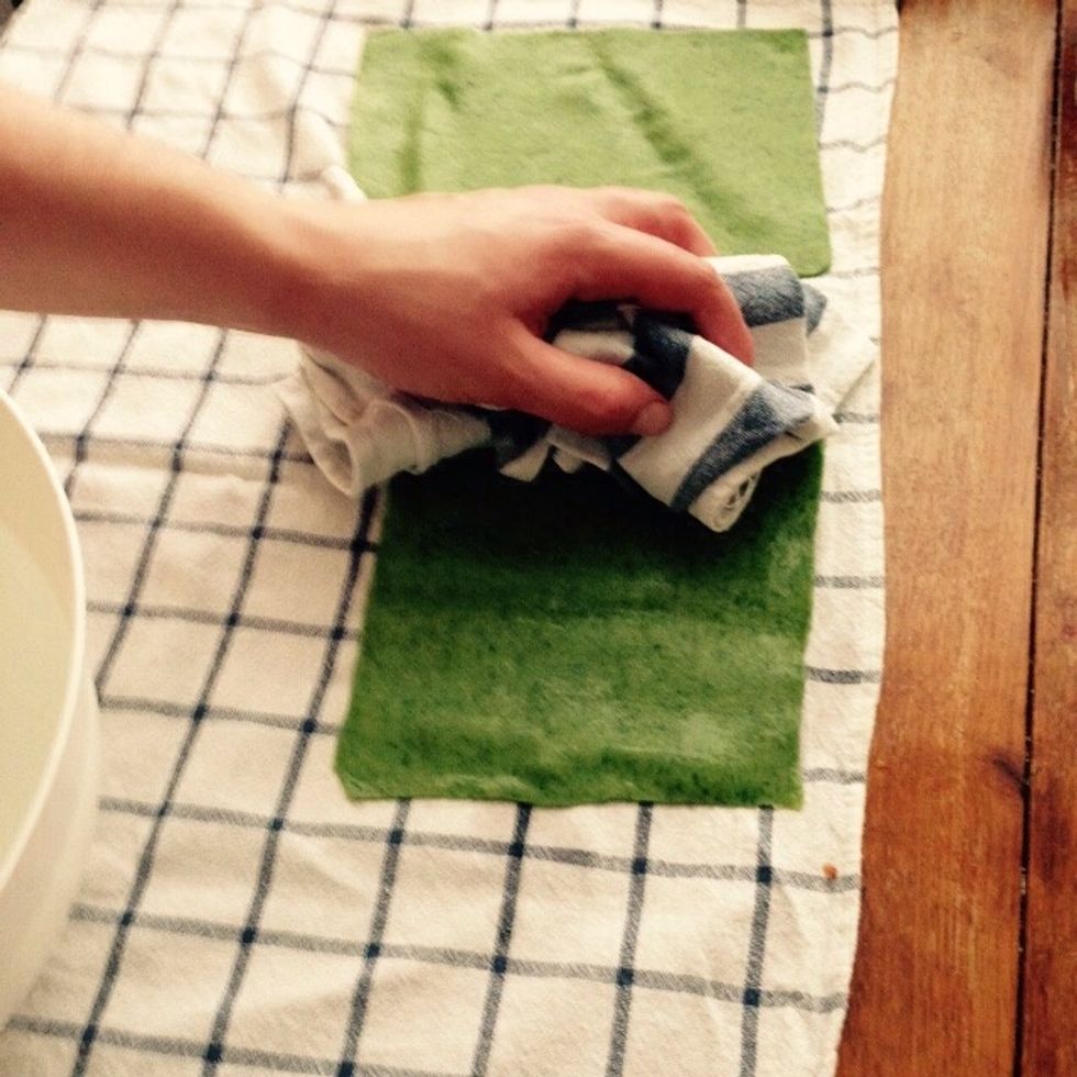 Lay down a clean kitchen towel, take out the pasta sheets from the cold water and put them on the towel to drain. Using a second towel drain the water on top of the pasta sheet as well.