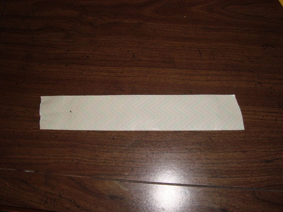 Lay down a piece of tape, sticky side up.