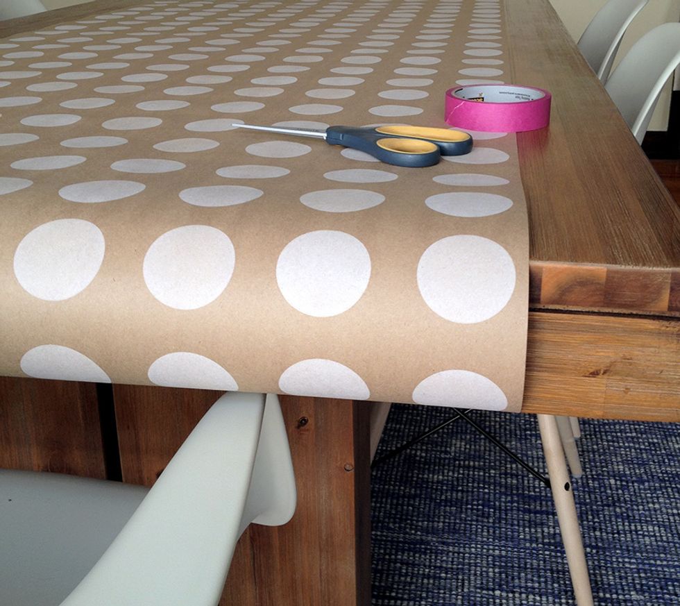 Lay down your wrapping paper on a flat surface.