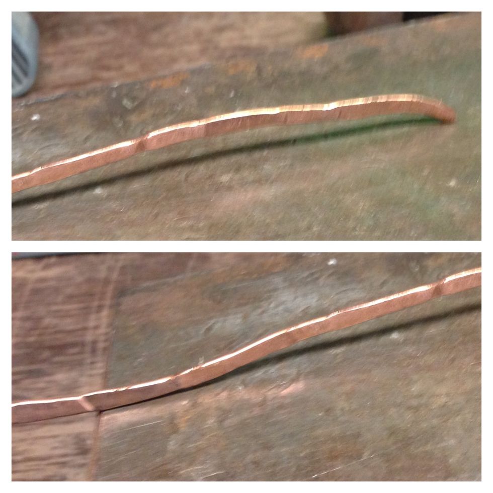 Lay each curve on the bench block, and lightly hammer the raised part. Keep checking for curves this way, hammering them flat.