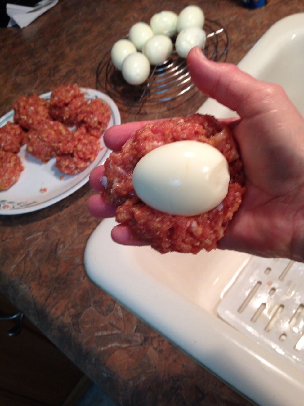 Lay egg onto slightly flattened meat mixture...