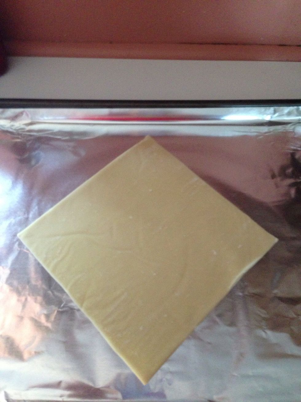 Lay egg roll wrapper on flat surface.