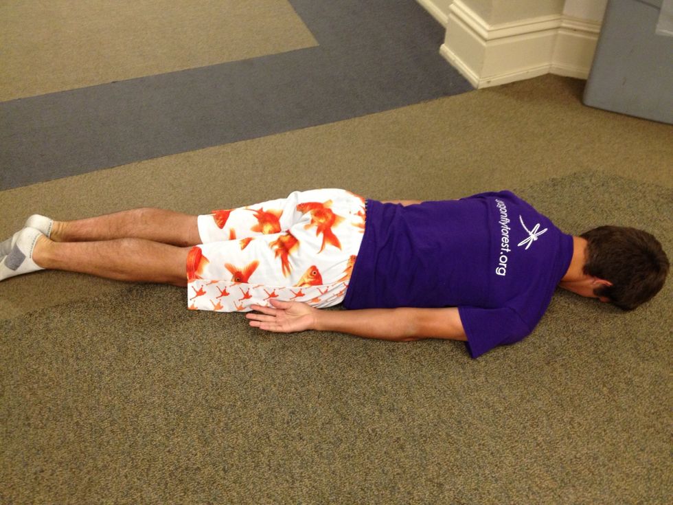 Lay face down on the floor