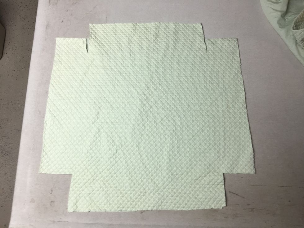 Lay it back out on your table and create the circle cuts for the legs.  Mine only needed to be the size of a quarter.