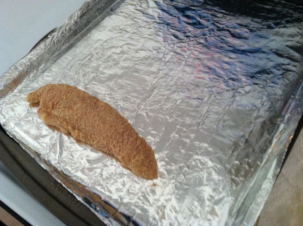 Lay it on the cookie sheet. Repeat until you have finished all the chicken.