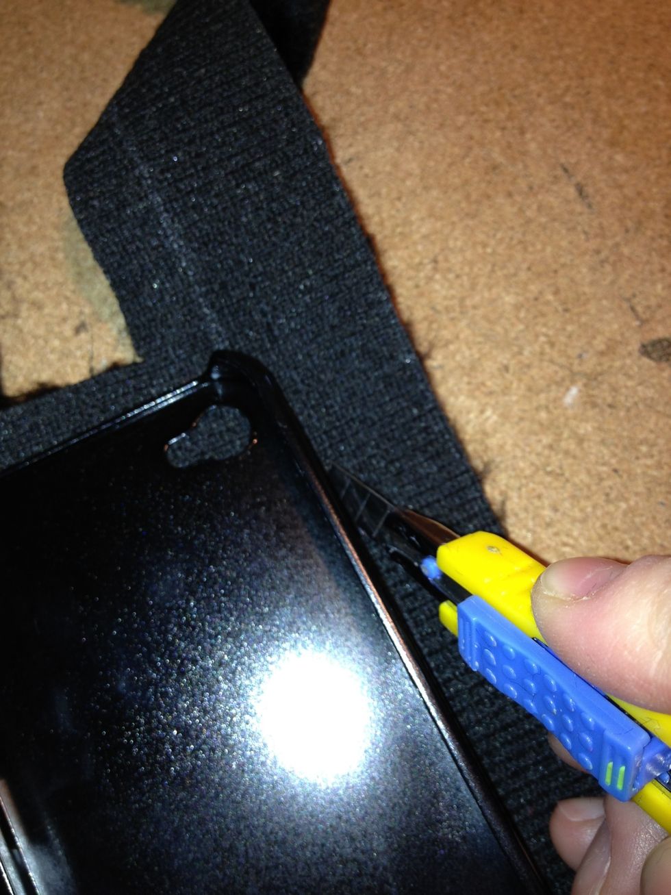 Lay it on the fabric and use the knife to cut along the sides.