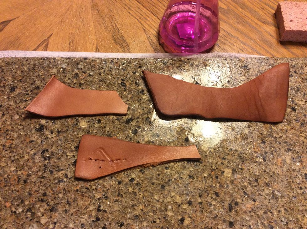 Lay leather on a hard surface.