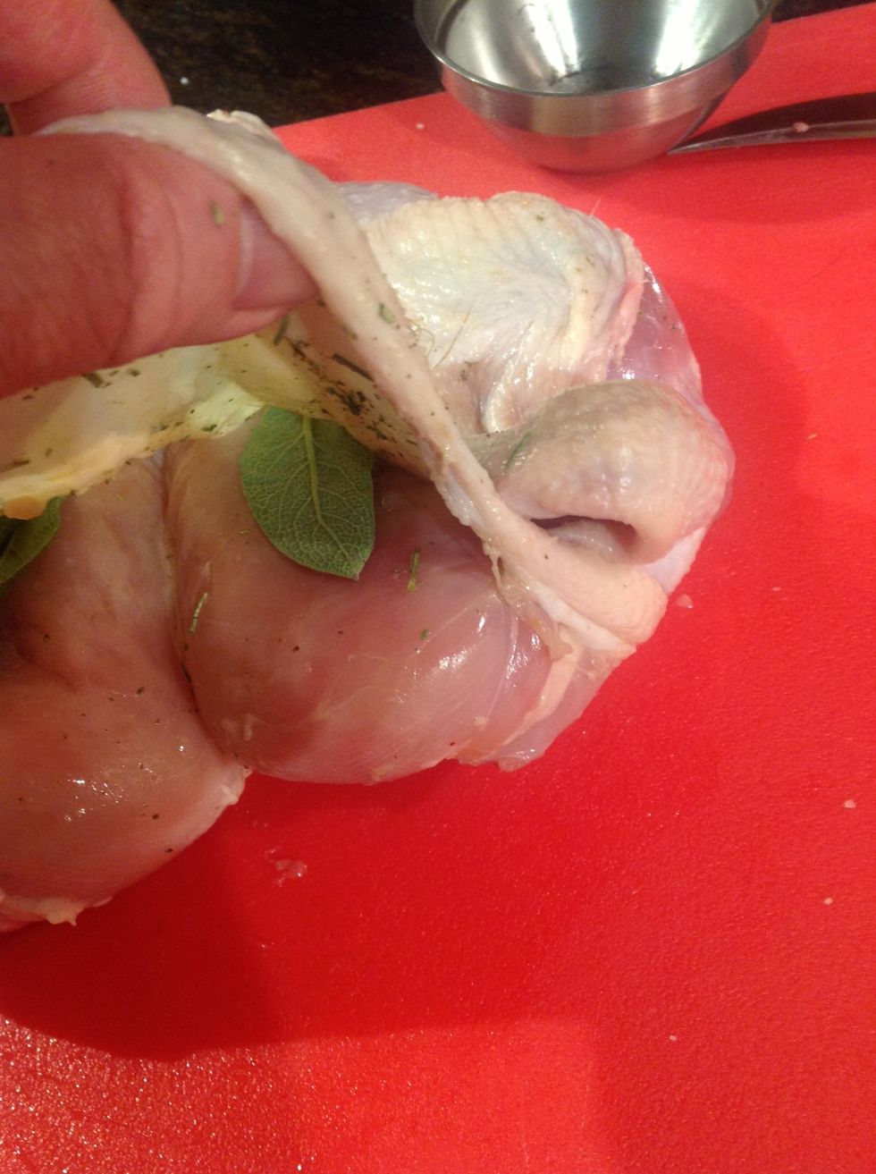 Lay one large fresh leaf on each breast, use smaller leaf for each thigh.