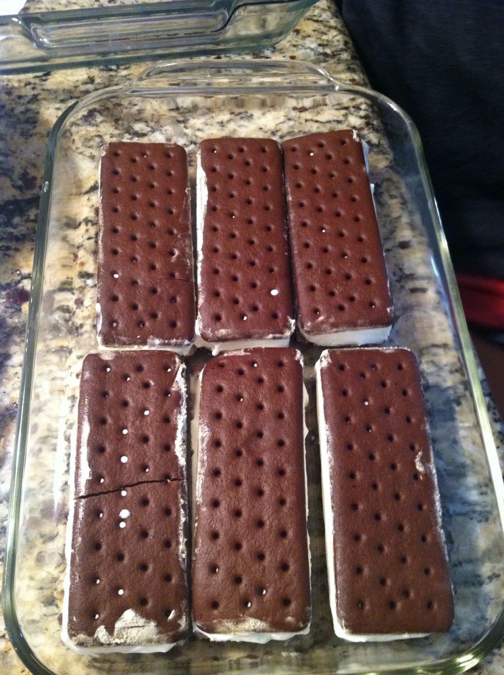 Lay out 6 ice cream sandwiches in the bottom of a glass pan