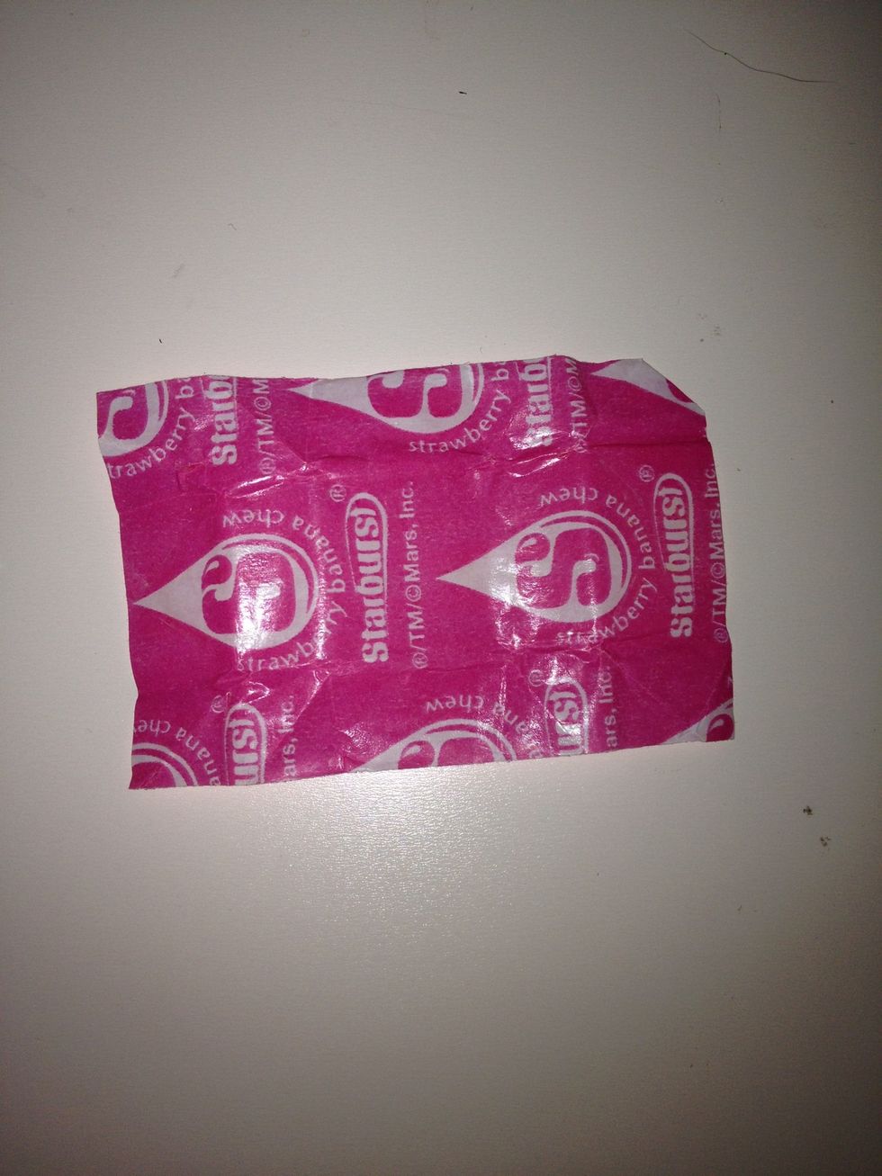 Lay out a starburst wrapper and make sure it is entirely unfolded and isn't torn. A huge tip is to carefully unwrap starbursts when eating them and collecting wrappers.