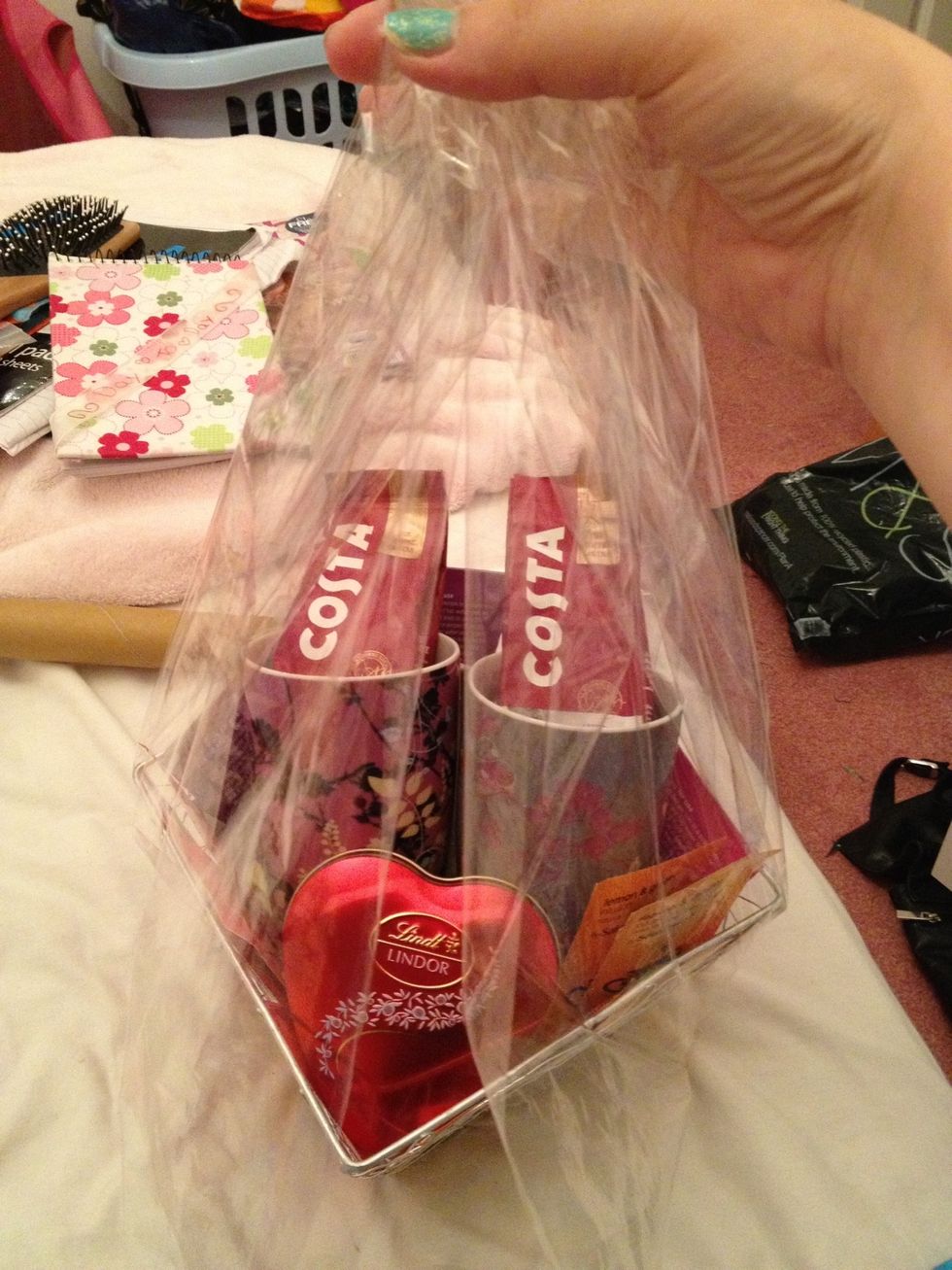 Lay out cellophane wrap and gently start to gather