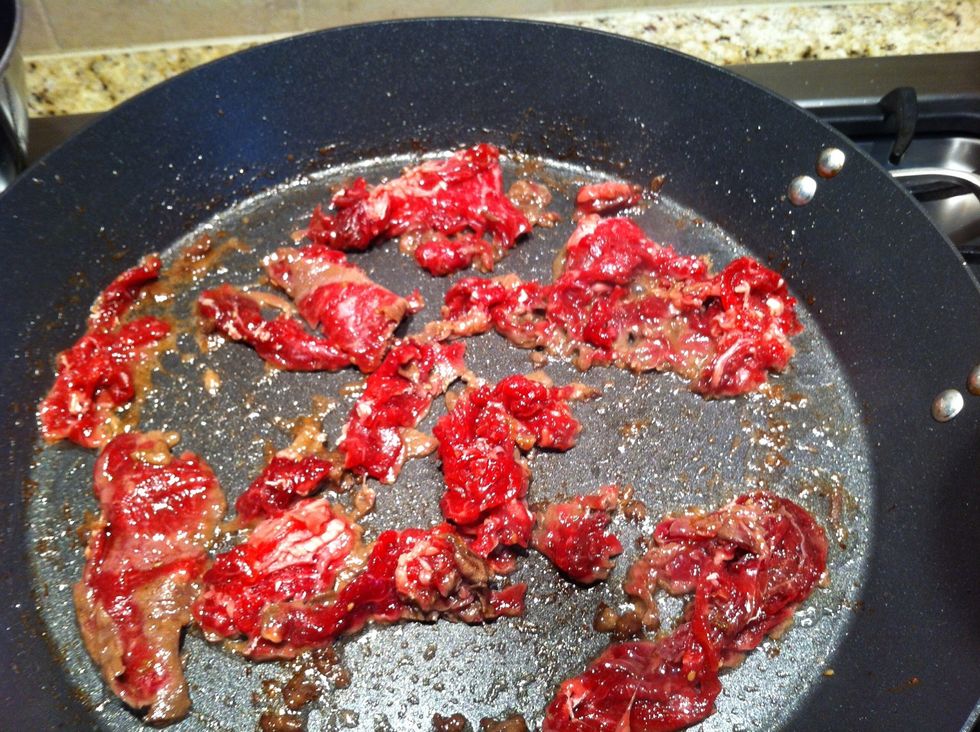 Lay out several pieces of beef in the pan with a little oil olive oil and cook only until no longer red. Avoid overcooking otherwise beef will be tough.