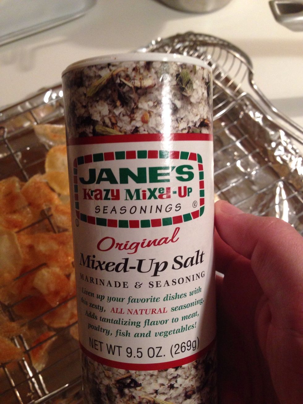 Lay out the chips on the rack and get your seasoning salt ready. In my house, we use this stuff on just about everything. It is SOOOO good!