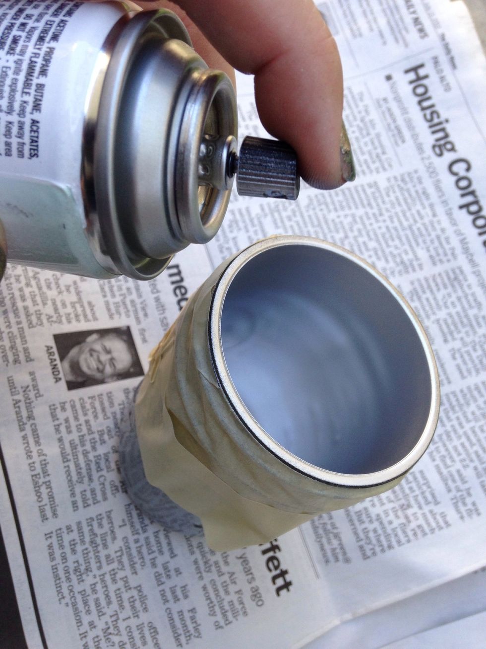 Lay out the newspaper and spray the inside of the jar thoroughly. Chose a fun color of spray paint!
