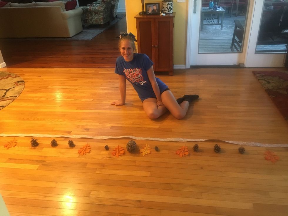 Lay out the ribbon and pine cones and leaves. Decide what you want your banner to look like