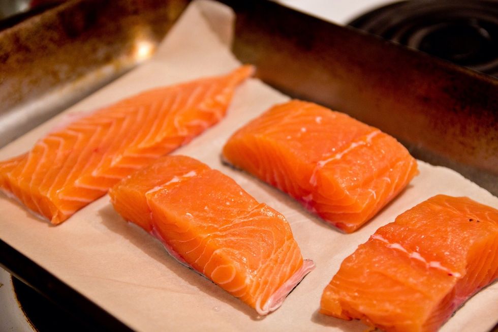 Lay out the salmon on a baking sheet with parchment. The parchment make clean up south easier.