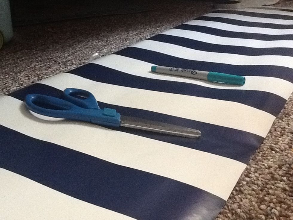 Lay out the sheet right side up and tape down the seams if you have any and the sides for reinforcement