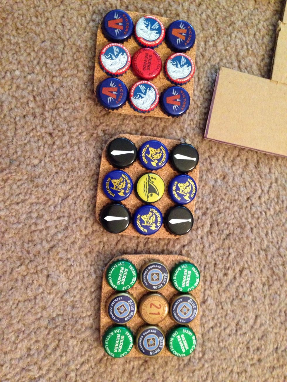 Lay out your caps in different patterns on the coasters until you like the way they look. Take a picture so you don't forget and use it as reference when gluing them down.