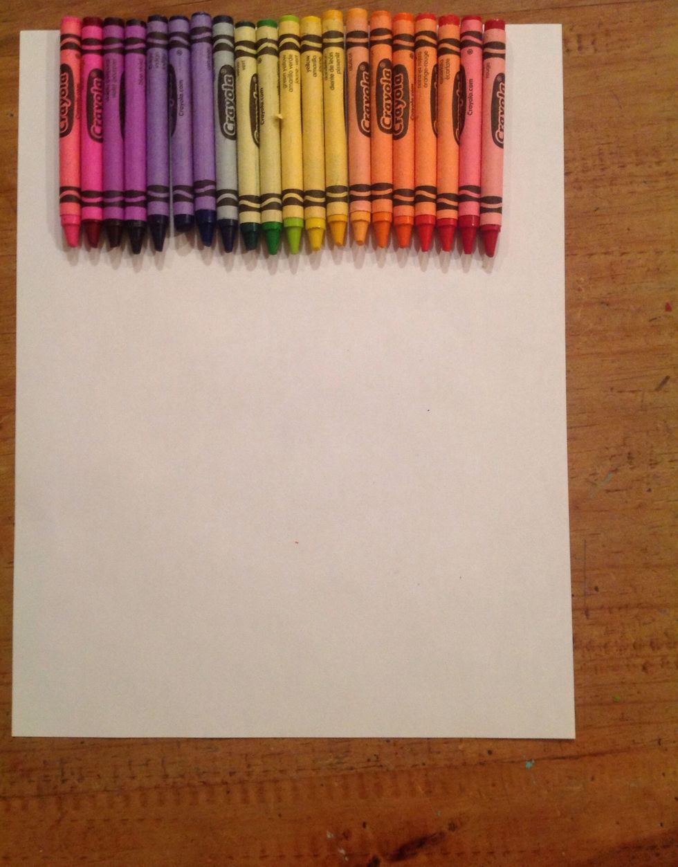 Lay out your chosen crayons on the top of the canvas with the tips pointing down. Make sure you have enough crayons to go across the top so they fit correctly.