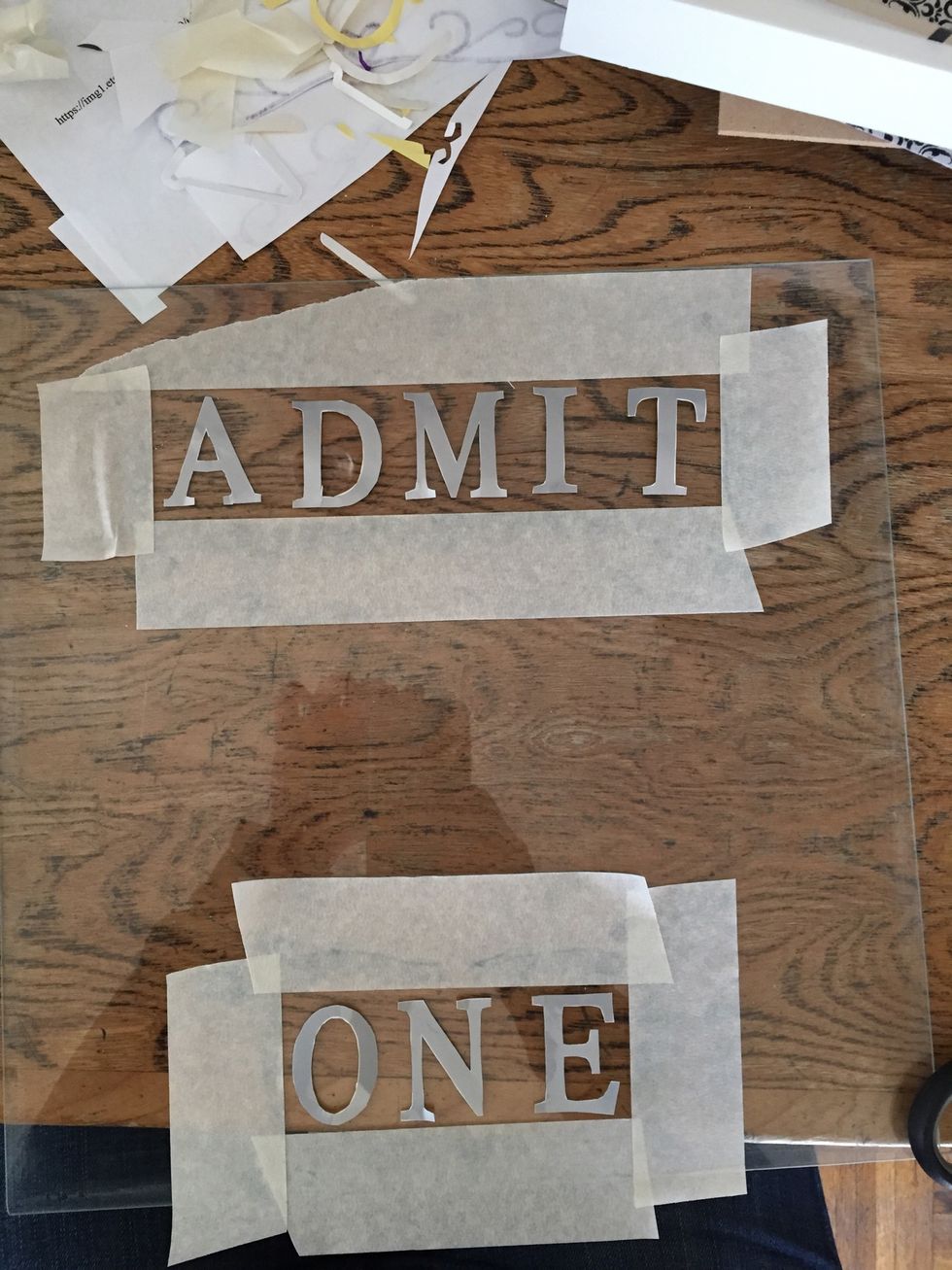Lay out your letters and make a boarder with the painters tape.