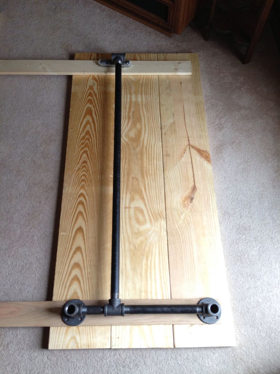 Lay out your pipes to determine where you need to drill your holes for the support boards. I drilled 3 holes through the support board (horizontal) into each desk top board totaling 9 holes.