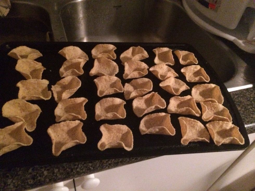 Lay out your scoops on a baking tray. If you find one that's too flat throw it away or eat it as we only want the 'scoopiest' scoops.