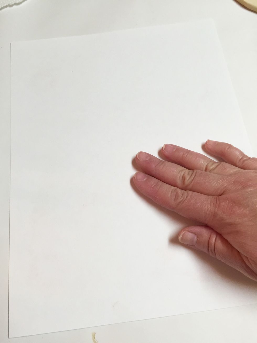 lay paper over plate and gently smooth all over with fingers to transfer inks.