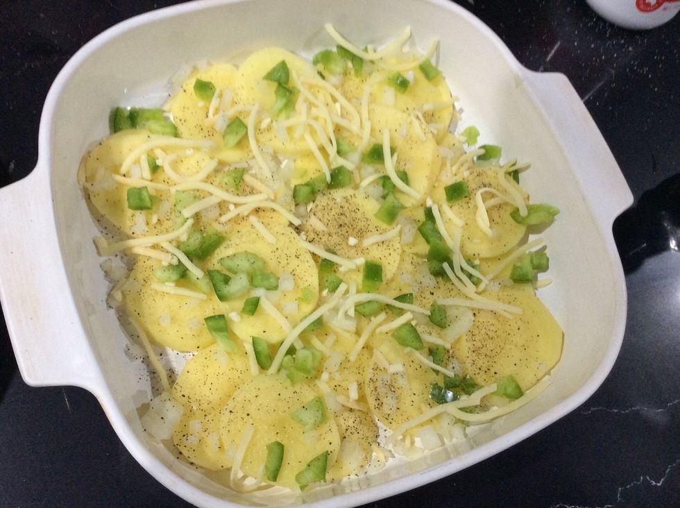 Lay potatoes,capsicum,onion,salt and pepper and cheese continue this process for another 3 layers