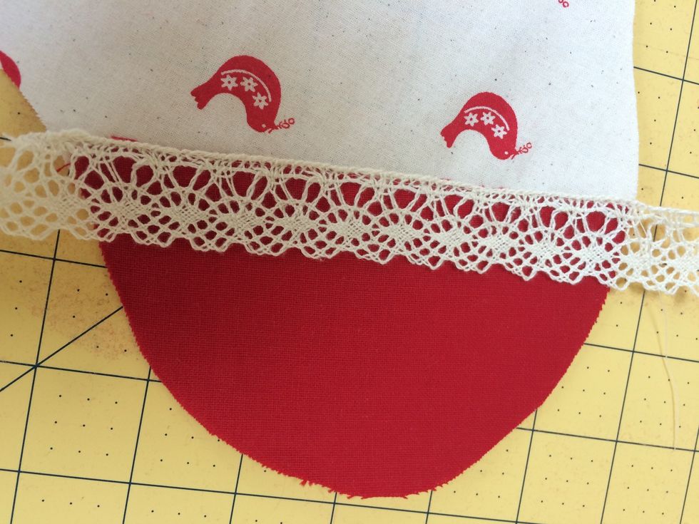 Lay ribbon across join and sew in position