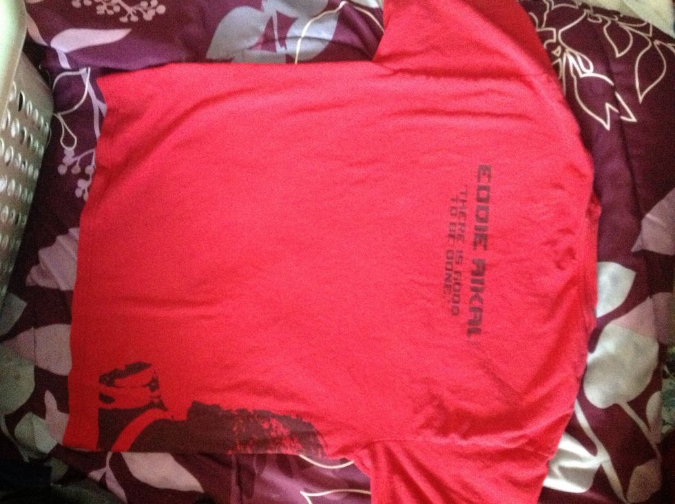 Lay shirt out on a flat surface
