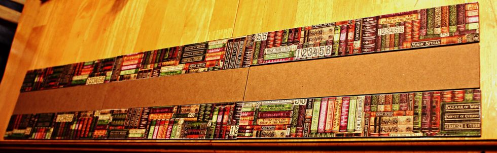 Lay strips down separating them  about 2 1/2".  Glue prepared letters to top of prepared strips.