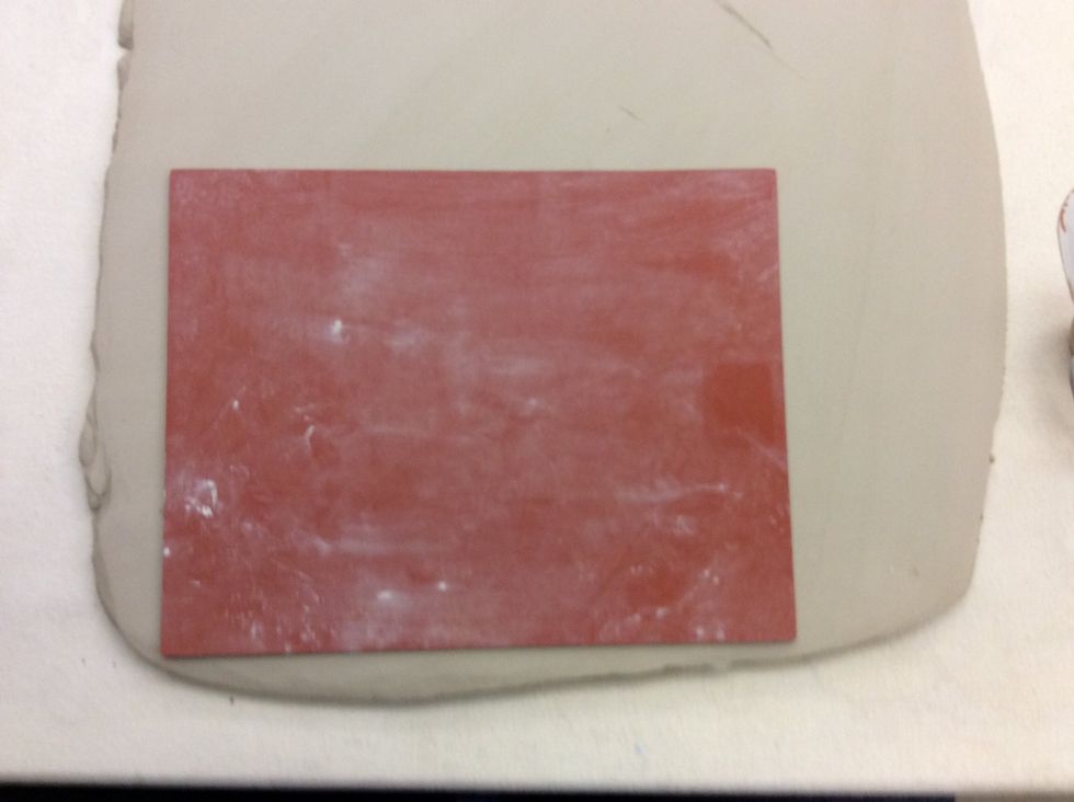 Lay texture mat on top of clay and use a pony roller to press texture into the clay.