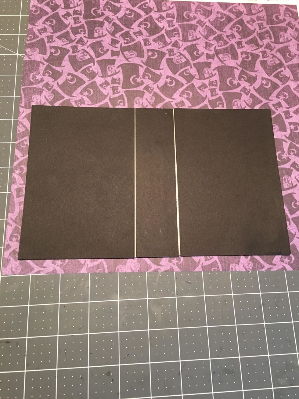 Lay the assembled cover onto the patterned paper of your choice. Cut around all 4 sides so that you have about 3/4" - 1" of paper around all 4 sides.