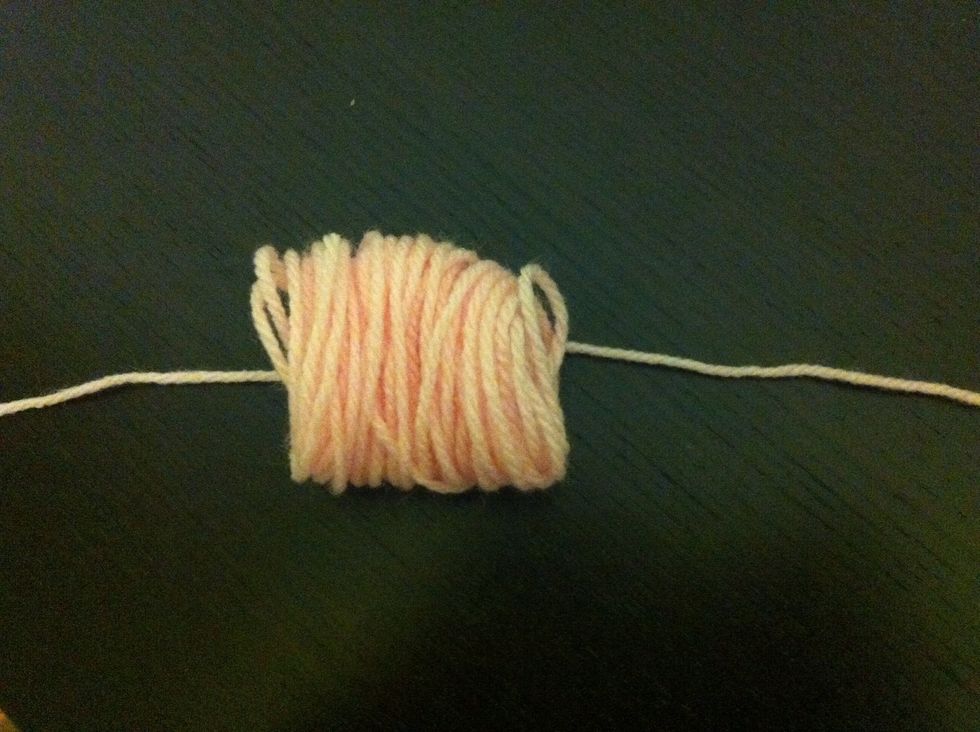 Lay the coiled up yarn near the end of the piece