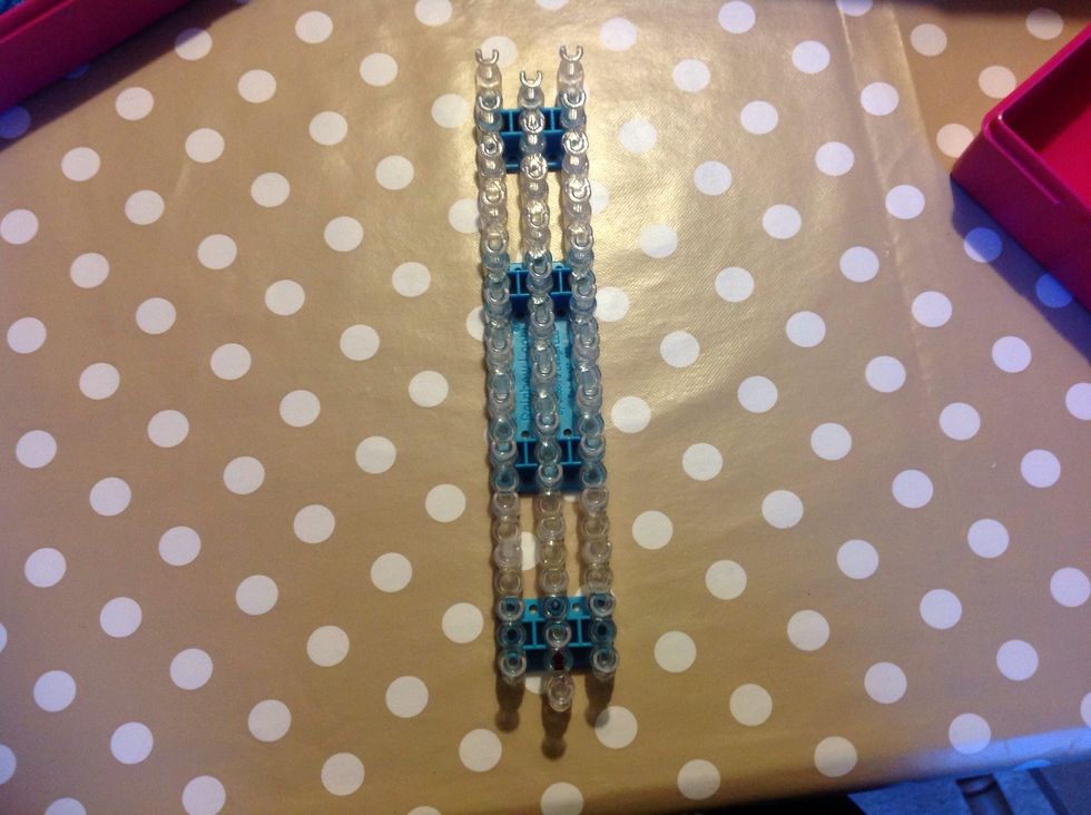 Lay the loom with the arrow pointing away from you.
