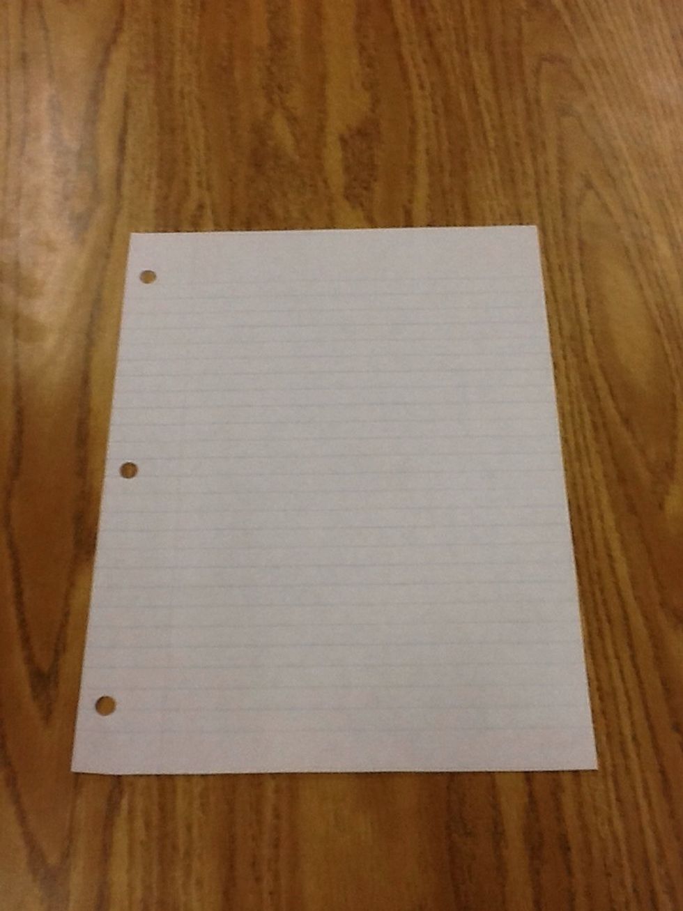 Lay the piece of paper on a flat surface