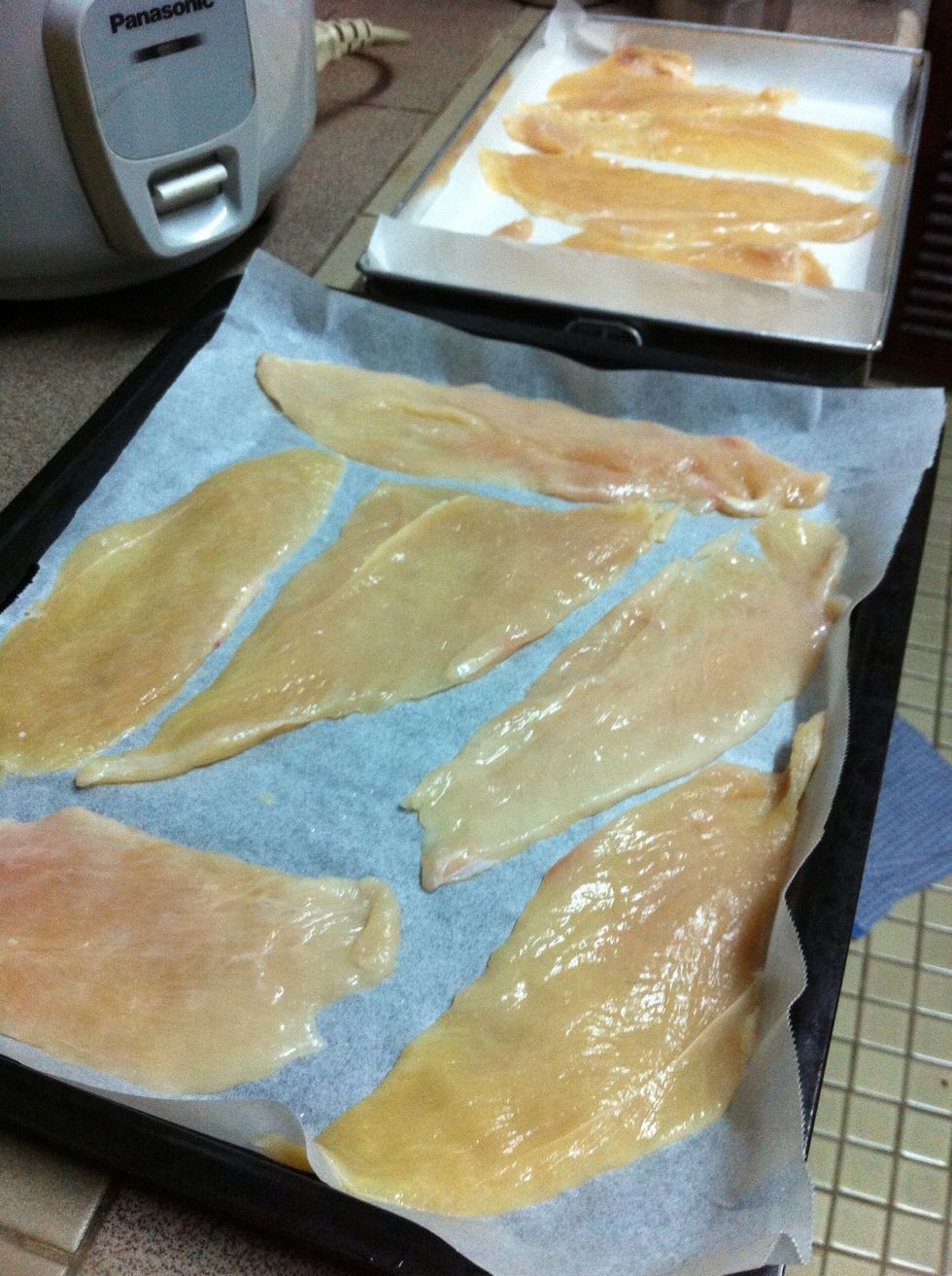 Lay the pieces flat on top of the baking paper.