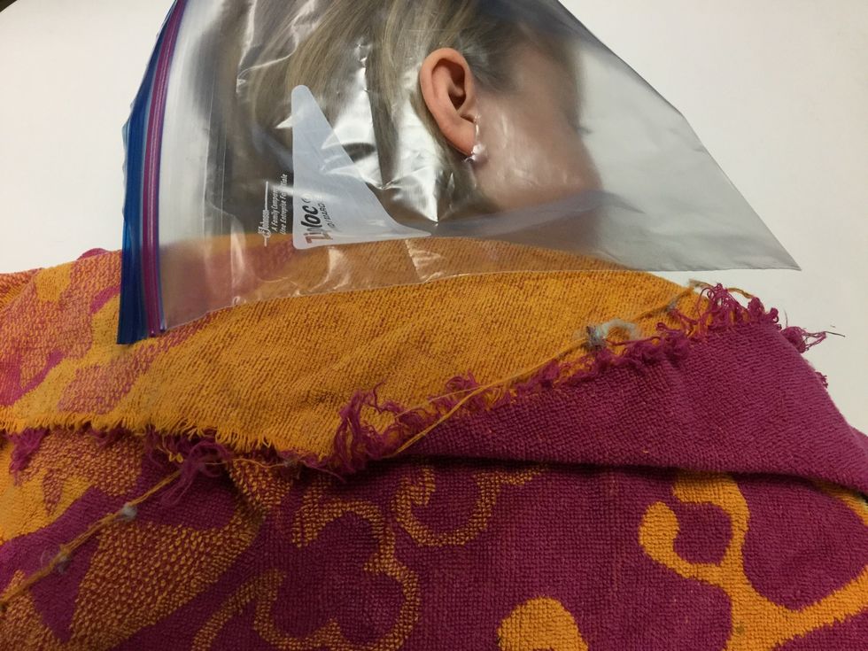 Lay the rag over your friends shoulders