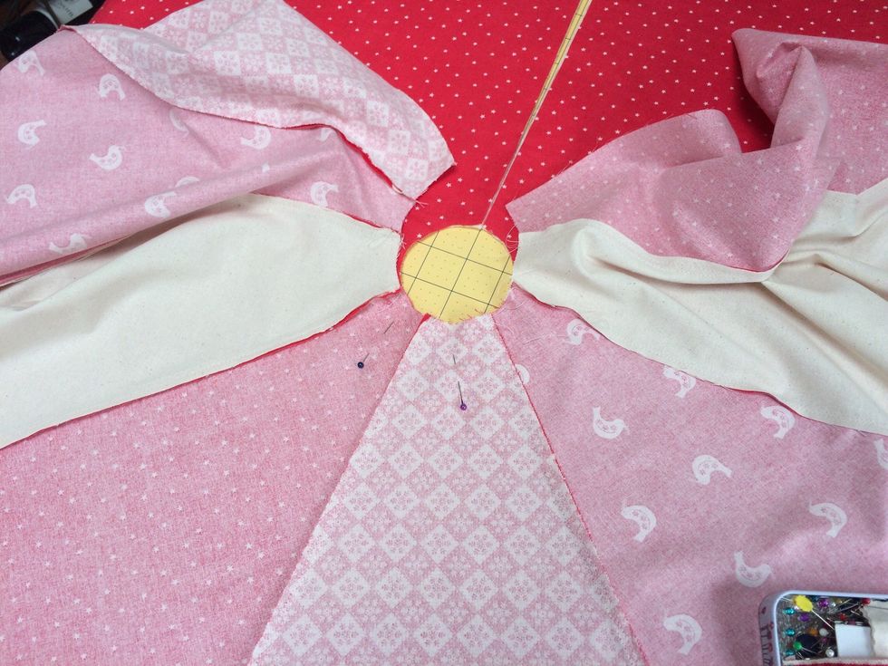 Lay the segmented piece on top of lace trimmed back and pin in place . Sew all around from batting side leaving a 6 inch gap in one of the opening sides. Make sure the lace is tucked in