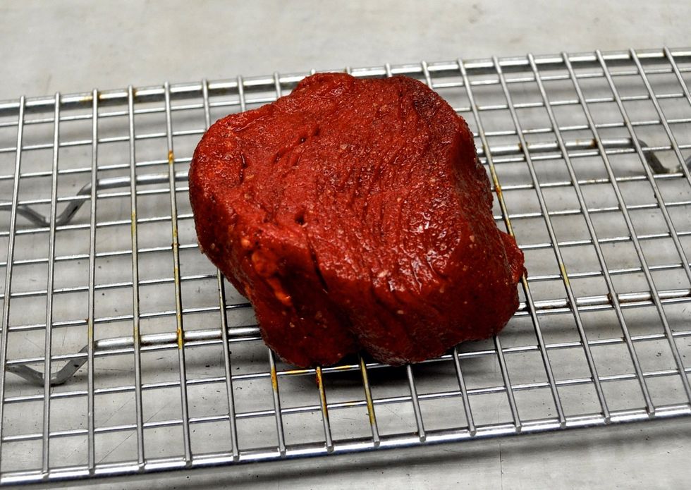 Lay the steaks out on a rack before you put them in the oven.