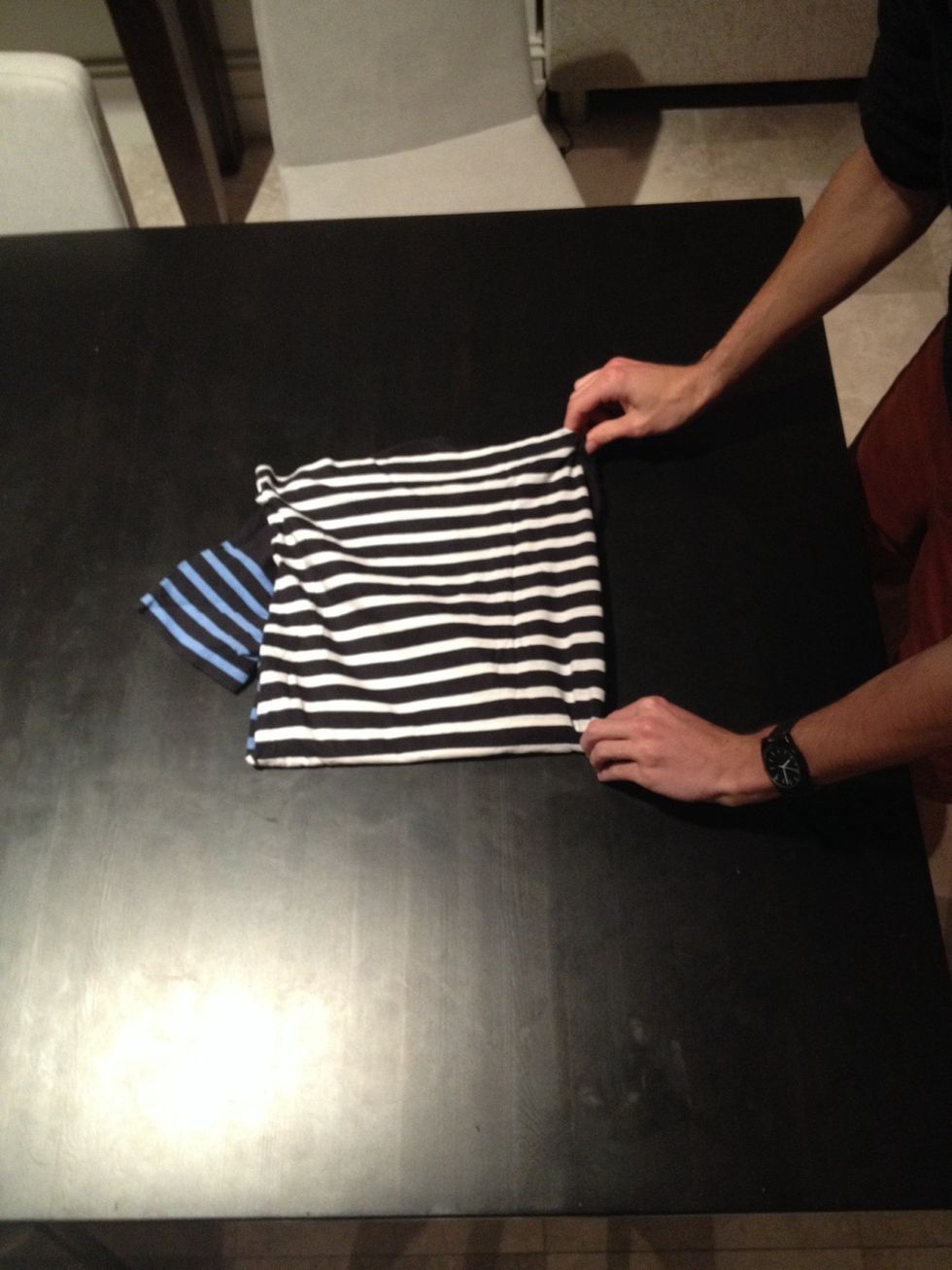 Lay the t-shirt on the table...