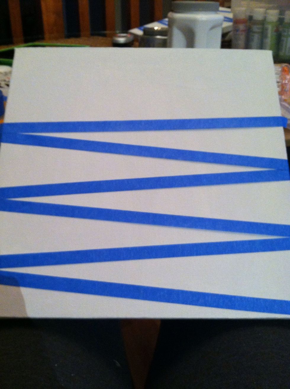 Lay the tape any direction that you choose on the canvas